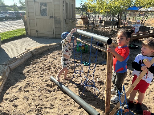 Exploring pipes and loose parts on the playground