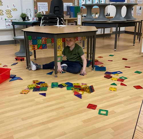 child under table